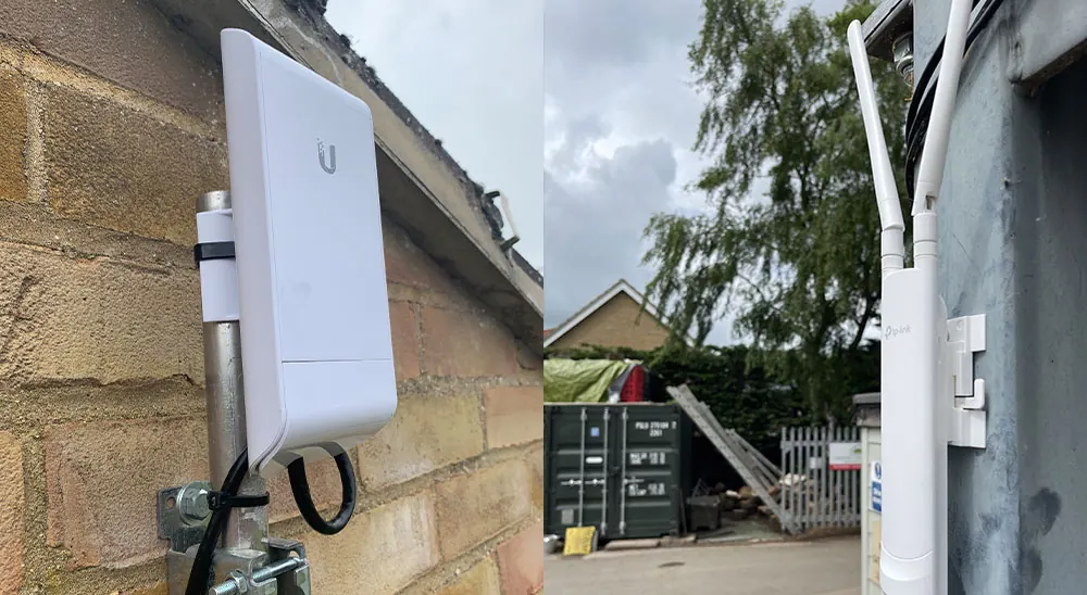 Point-to-point wireless bridge antennas fitted to the outside walls of two separate buildings